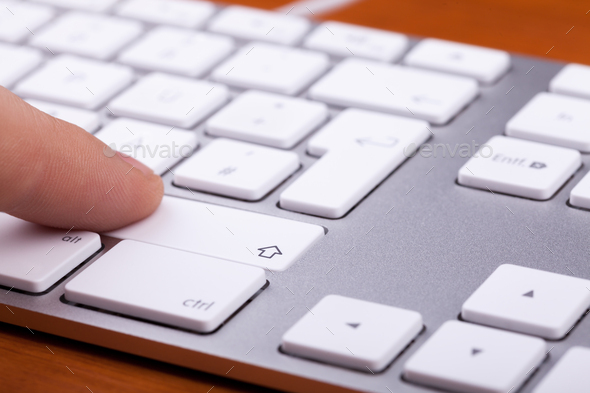 Aluminium keyboard with finger pressing on key