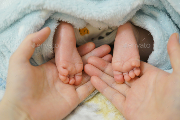 Three months old boy's feet  - Stock Photo - Images