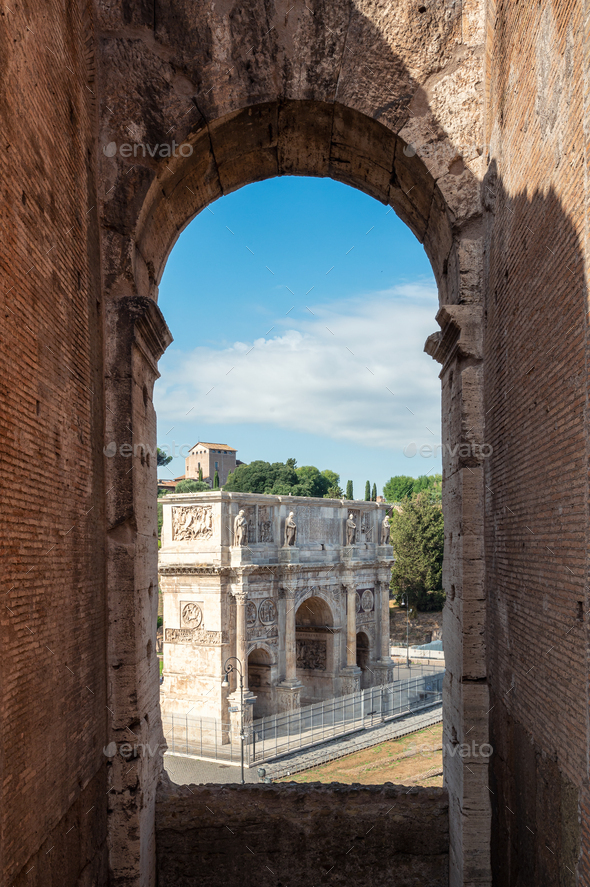 View of the Arch of Constantine framed with Colosseum arch window - Stock Photo - Images