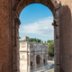 View of the Arch of Constantine framed with Colosseum arch window - PhotoDune Item for Sale