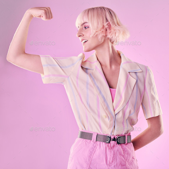 Woman, flexing arm muscle and smile, power and strong female and winner  isolated on pink background Stock Photo by YuriArcursPeopleimages