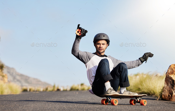 Skateboard, slide and man in road for sports competition, fitness training and exercise on mountain