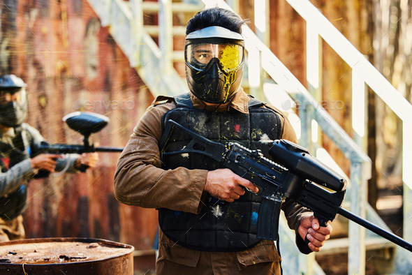 Portrait, paintball or man with gun in a game or competition for fitness, exercise or cardio workou - Stock Photo - Images