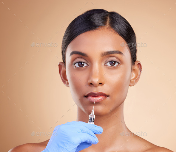 Lip filler, beauty or portrait of Indian woman with injection for plastic surgery, cosmetics or bot