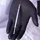 Hand in black glove holding cosmetic syringe. - PhotoDune Item for Sale
