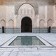 View of a courtyard of an islamic palace in Morocco, small pool in the centre, marble and amazing do - PhotoDune Item for Sale
