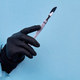 Close up hand in black glove holding scalpel. - PhotoDune Item for Sale