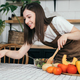 woman cooking healthy food from fresh vegetables and fruits in kitchen room. - PhotoDune Item for Sale