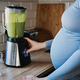 Green Smoothies Recipes For Pregnancy and Postpartum, Prenatal Nutrition. Pregnant woman preparing - PhotoDune Item for Sale