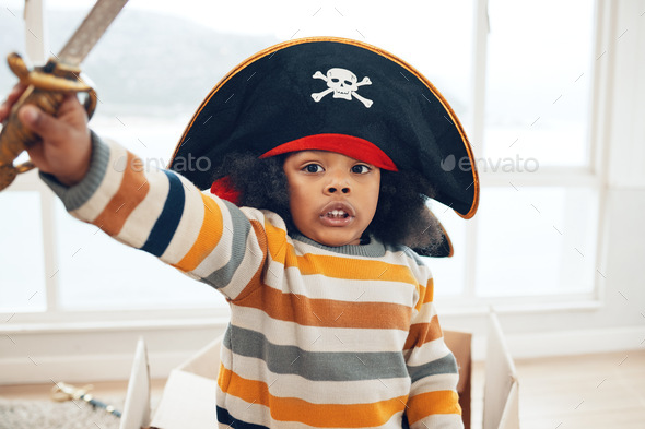 Pirate, box and portrait of black child in living room for creative, playful and fantasy. Sailing,