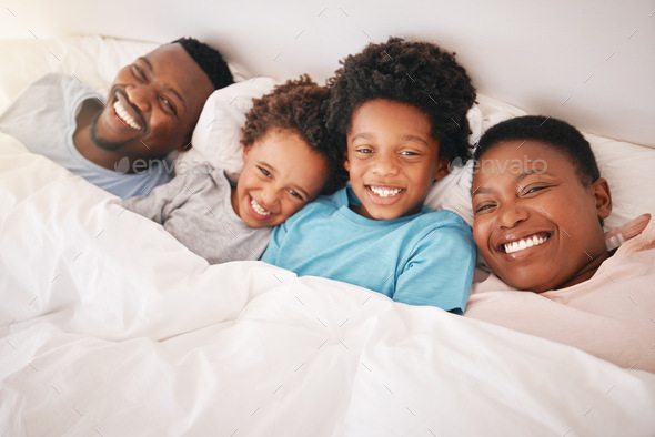 Smile, happy and relax with black family in bedroom for bonding, wake up and morning routine from t - Stock Photo - Images