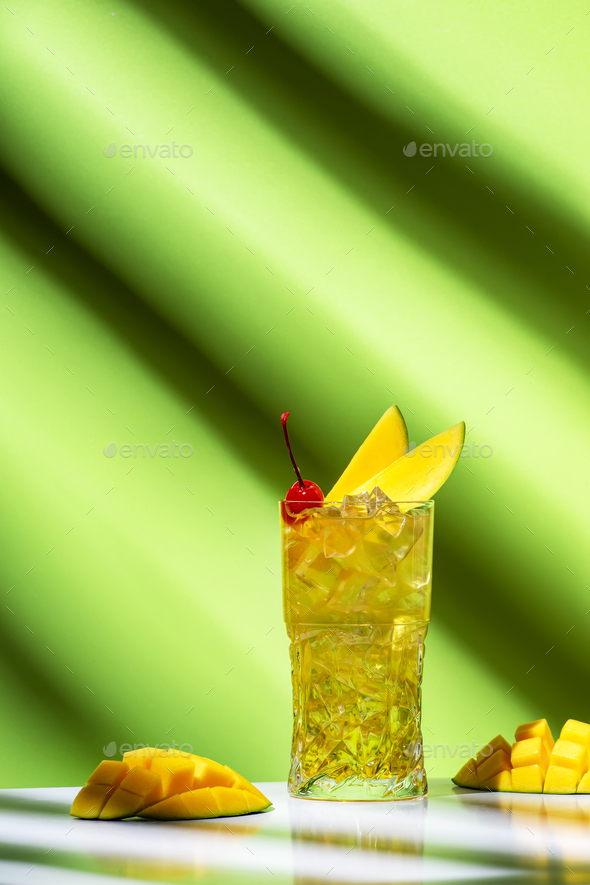 Mango rum collins alcoholic cocktail drink with white rum, syrup