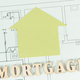 Inscription mortgage and home shape on construction diagrams of house - PhotoDune Item for Sale