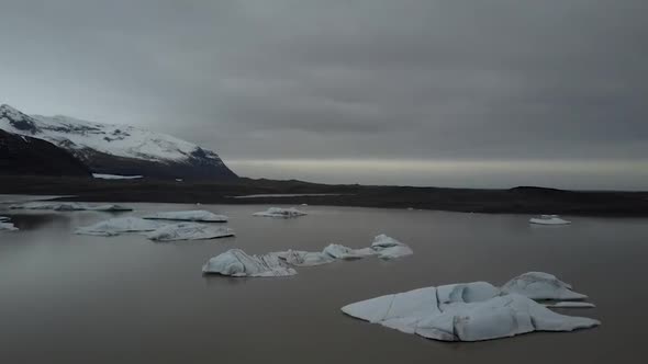 Aerial quiet ocean and cloudy sky in Iceland