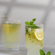 Lemonade with fresh lemon slices in a glass in the photo with a cinematic effect.  - PhotoDune Item for Sale