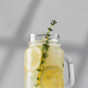 Promotional photo of lemonade with fresh lemon slices in a glass on the podium. Summer rdrink - PhotoDune Item for Sale
