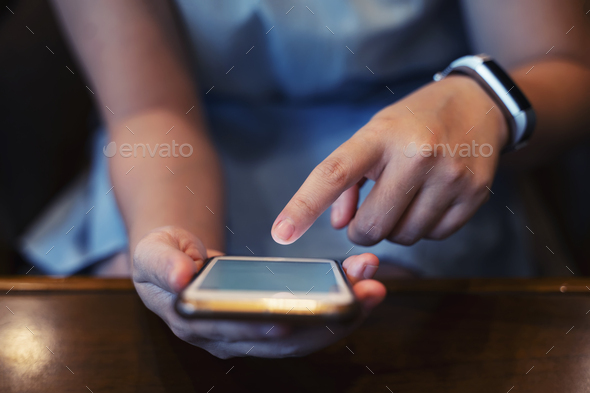 Closeup of hands using internet on mobile. Wireless network connection technology concept. - Stock Photo - Images