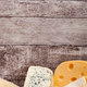 Healthy food. Differet type of cheese on wooden background - PhotoDune Item for Sale
