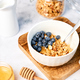 Homemade granola with nuts and fresh blueberries for breakfast. Healthy breakfast. Vegetarian food - PhotoDune Item for Sale