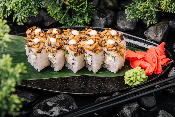 sushi roll set with shiitake mushrooms Stock Photo by AntAlexStudio