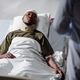 Soldier with injury lying on bed in hospital - PhotoDune Item for Sale