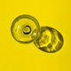 top view of empty glass with reflextion on yellow background - PhotoDune Item for Sale
