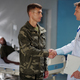 Soldier shaking hands with doctor in hospital - PhotoDune Item for Sale