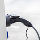 charger plug to an electric vehicle from charging station. - PhotoDune Item for Sale