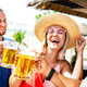 Trendy happy friends toasting beer at chiringuito beach bar - PhotoDune Item for Sale