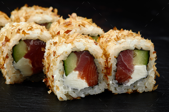 Japanese restaurant menu photo, seafood, national cuisine. Tuna and cheese sushi rolls set served on