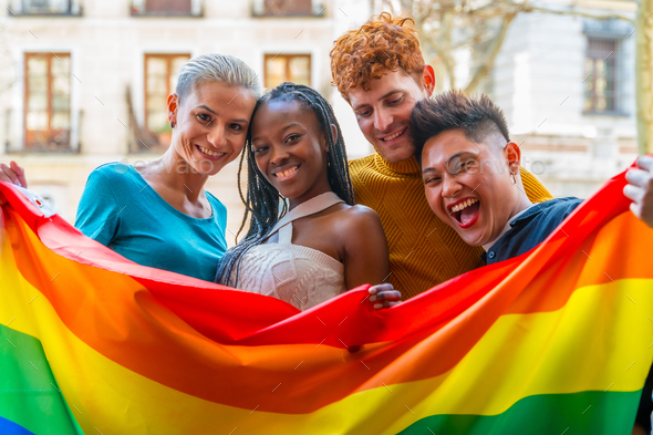 Lgtb couples of lesbian gay boys and girls in a portrait with rainbow ...