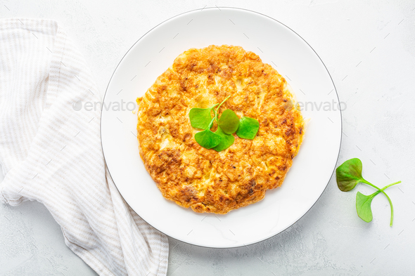 Spanish omelet (Tortilla de patatas) with potatoes and onion - Stock Photo - Images