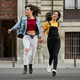Two teenager girls running down street. - PhotoDune Item for Sale