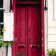 Entrance to the house with an old vintage wooden door in magenta color - PhotoDune Item for Sale