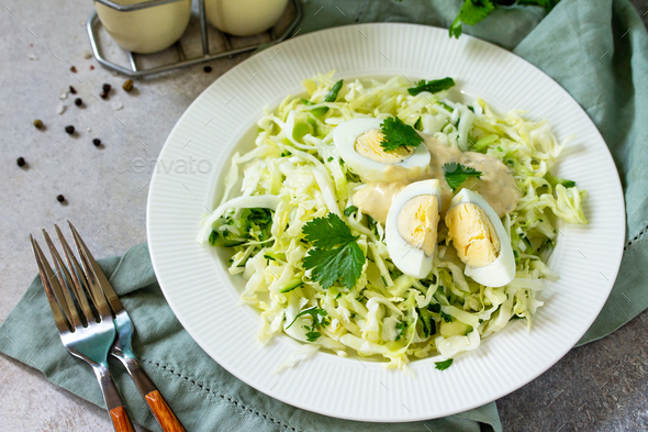 Vegan salad with cabbage, eggs, cucumber.  - Stock Photo - Images