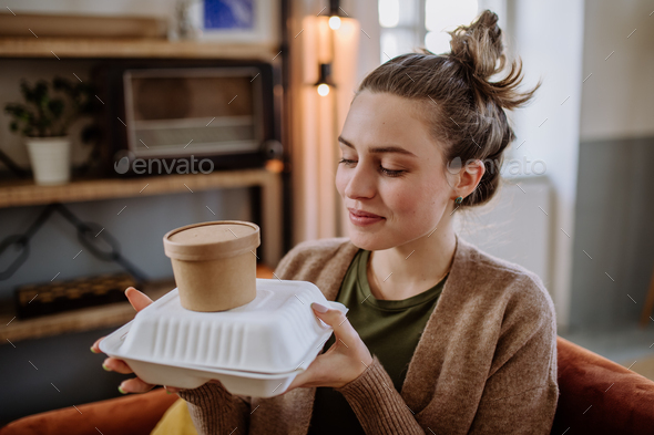 Young woman ordered lunch from the restaurant. - Stock Photo - Images