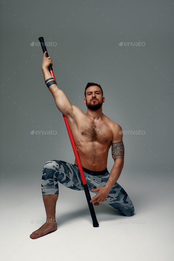 A Ninja Man Stands in a Fighting Stance Against a Gray Background. Front  View Stock Image - Image of aggression, combative: 105554637