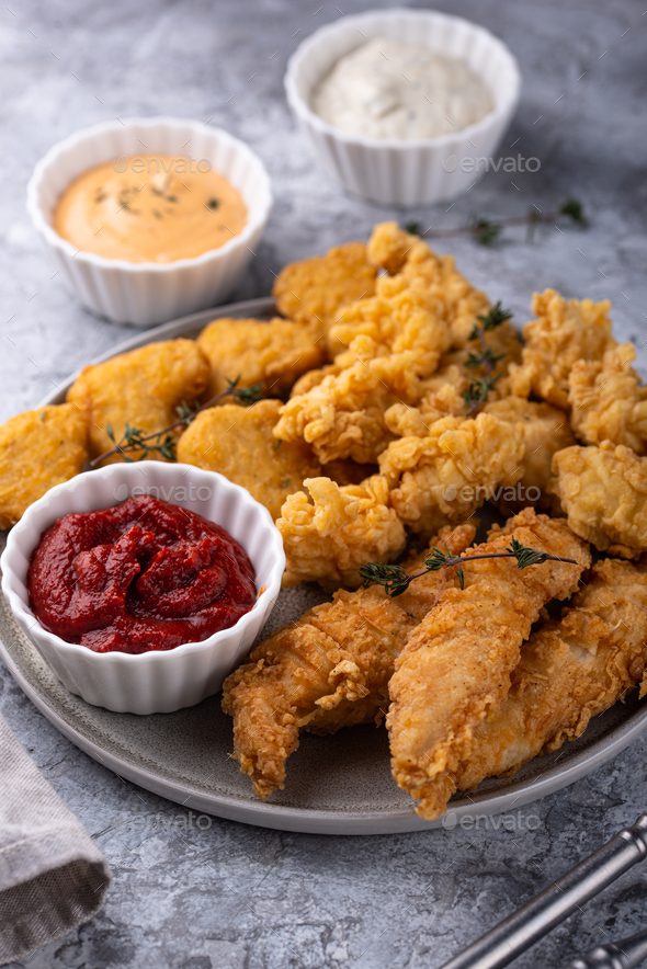 Chicken nuggets, strips and bites - Stock Photo - Images