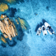 Aerial view of beautiful boats and stones in blue sea in summer - PhotoDune Item for Sale