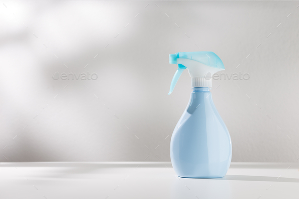 Blue spray bottle. - Stock Photo - Images