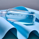 A glass bottle of pure water against the background of blue waves. - PhotoDune Item for Sale