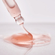Pipette with a viscous pink cosmetic close-up. - PhotoDune Item for Sale