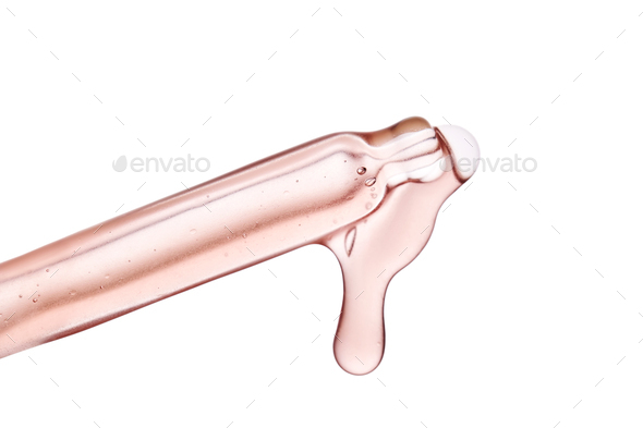Pipette with a viscous pink cosmetic close-up. - Stock Photo - Images