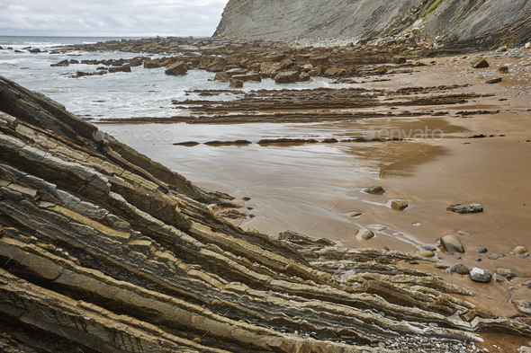 Flysch dramatic rock formation Cantabric sea in Zumaia, Euskadi - Stock Photo - Images