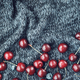 Red ripe cherries scattered on a dark blue knitted blanket. View from above. - PhotoDune Item for Sale