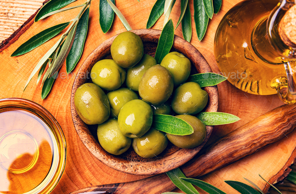 Green olives in wooden bowl - Stock Photo - Images