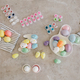 Holiday Easter preparations: handmade colored eggs, paints and brushes on a table. - PhotoDune Item for Sale