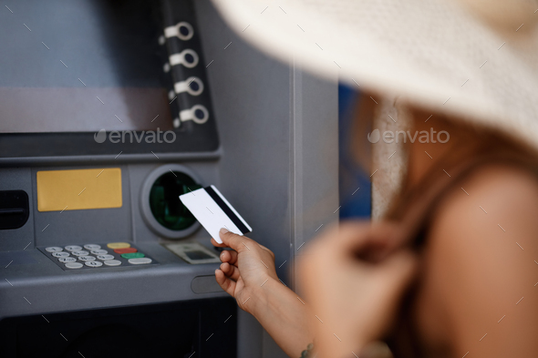 Close-up of withdrawing money from ATM. - Stock Photo - Images