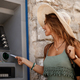 Happy woman using credit card while withdrawing money at ATM. - PhotoDune Item for Sale