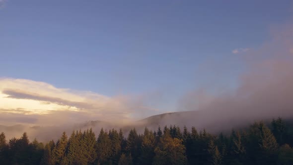 Nice Aerial Drone Shot Panning the Romanian Mountains with Moving Valley Fog alt